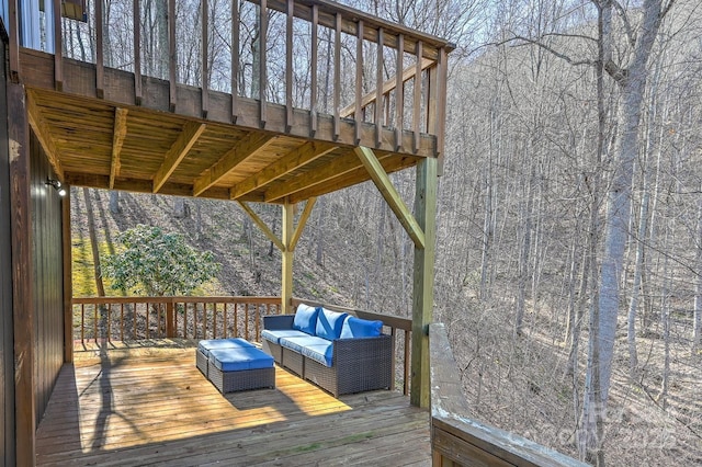 wooden terrace featuring an outdoor hangout area