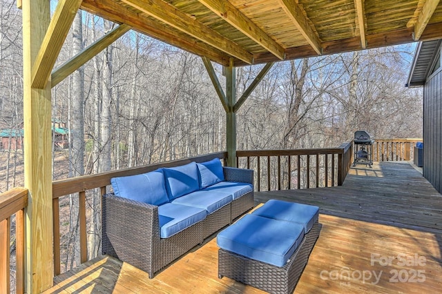 wooden deck with an outdoor living space