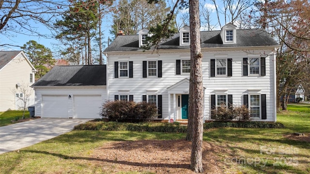 view of front of house featuring a garage, a front lawn, and concrete driveway