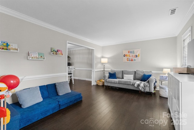 living room featuring ornamental molding, dark wood-style flooring, and visible vents