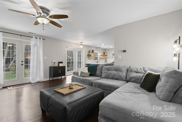 living room featuring ceiling fan, french doors, wood finished floors, and visible vents