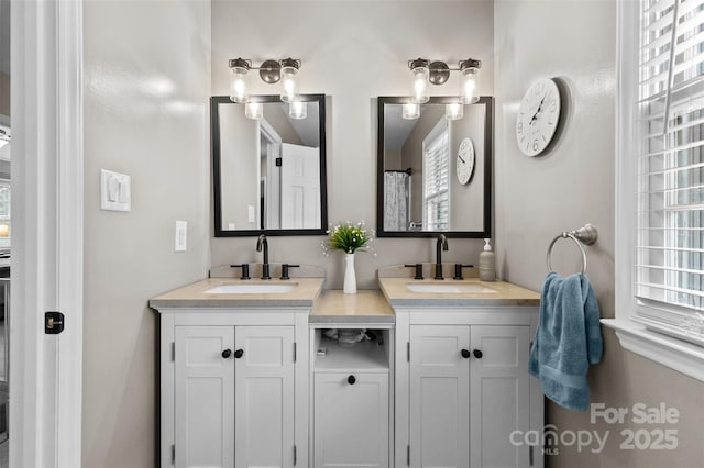 full bath featuring a sink and double vanity