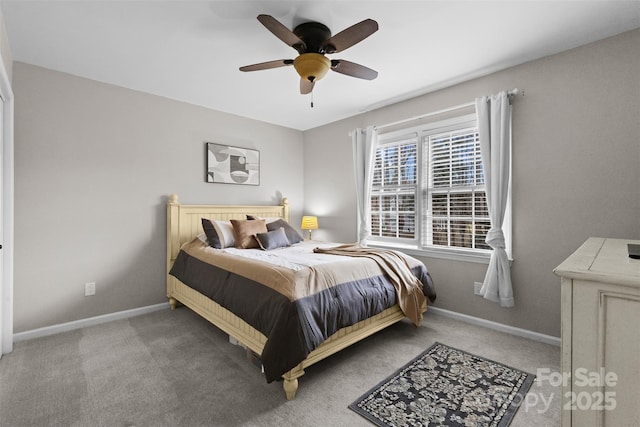 bedroom with carpet, baseboards, and a ceiling fan