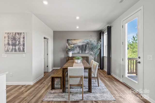 dining area featuring light wood-style floors, recessed lighting, and baseboards