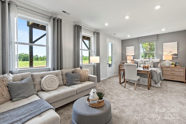 interior space featuring light carpet, visible vents, and recessed lighting