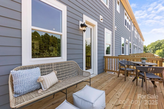 wooden deck with outdoor dining area