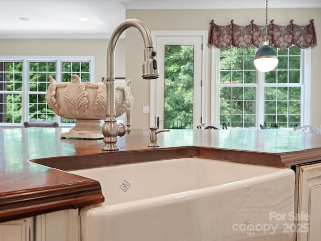 kitchen featuring hanging light fixtures and a sink