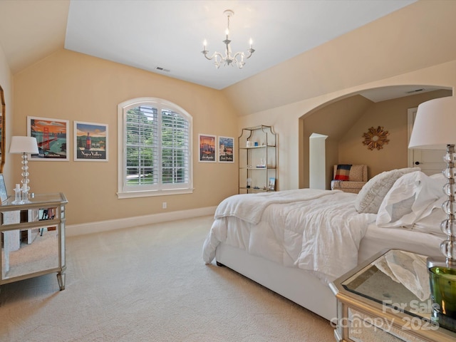 bedroom featuring vaulted ceiling, carpet floors, arched walkways, and visible vents