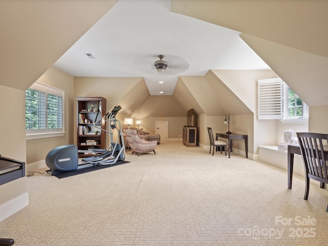 interior space with baseboards, visible vents, and carpet flooring