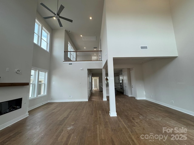 7441 Fighting Creek Rd Unit 30, Sherrills Ford, NC 28673 - unfurnished living room with a high ceiling, ceiling fan, a fireplace, dark wood finished floors, and recessed lighting