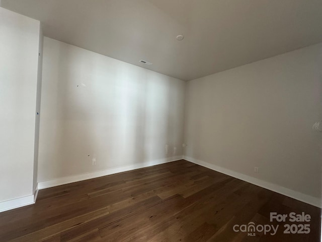 7441 Fighting Creek Rd Unit 30, Sherrills Ford, NC 28673 - spare room featuring dark wood finished floors and baseboards