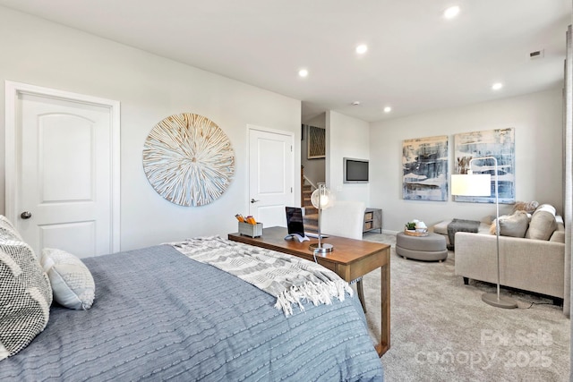 bedroom with light carpet, visible vents, and recessed lighting