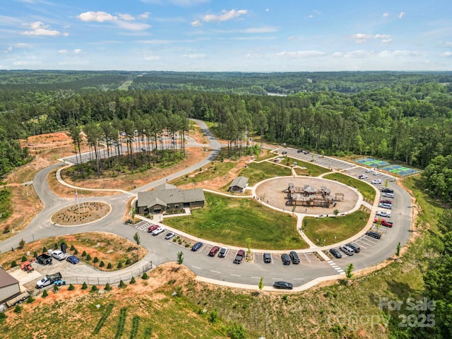 drone / aerial view with a view of trees