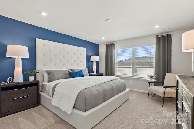 bedroom featuring recessed lighting, visible vents, light carpet, and baseboards