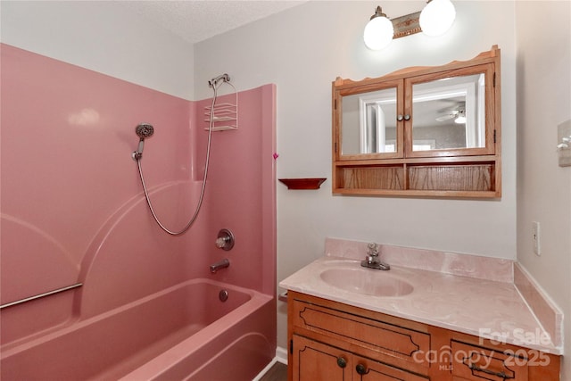 bathroom with shower / bathing tub combination and vanity