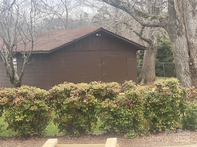 view of shed with fence