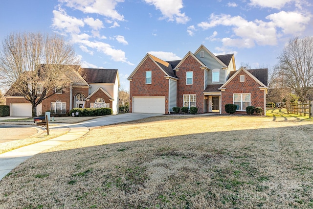 traditional-style house featuring an attached garage, brick siding, fence, driveway, and a front lawn