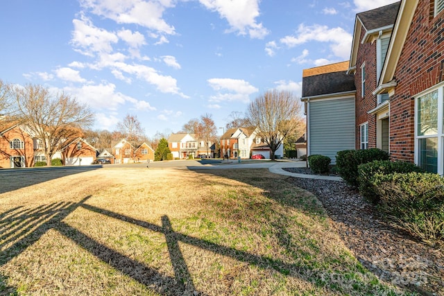 view of yard featuring a residential view