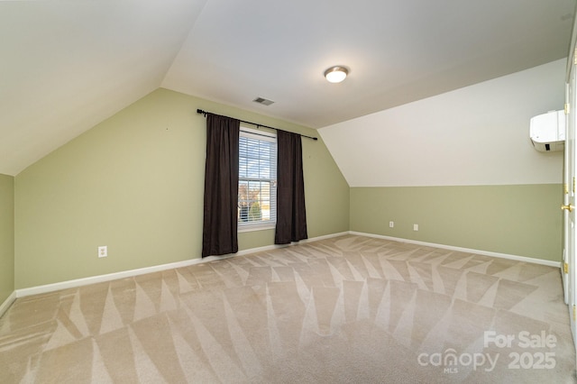 bonus room with lofted ceiling, light carpet, and baseboards