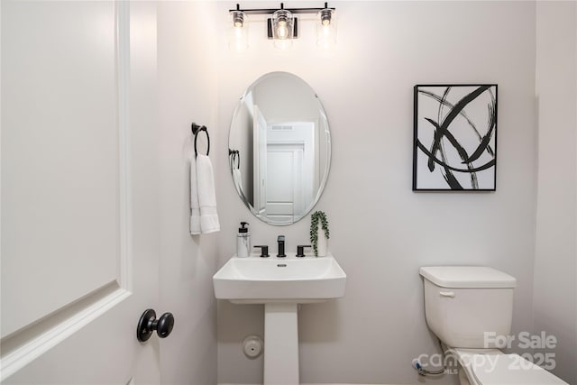 bathroom with a sink and toilet