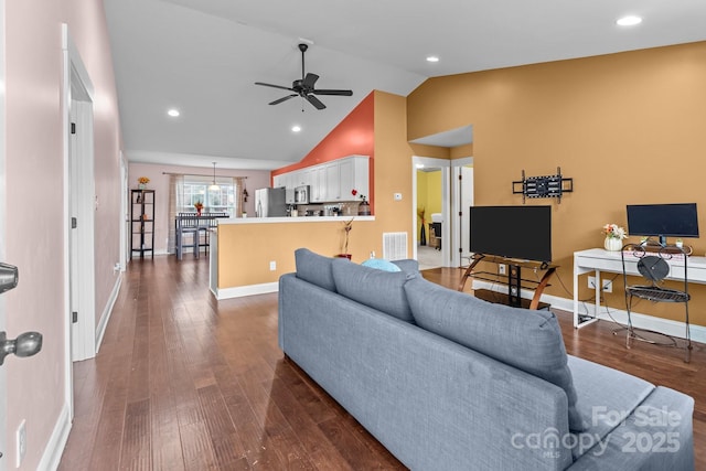 living room featuring a ceiling fan, baseboards, visible vents, and dark wood-type flooring