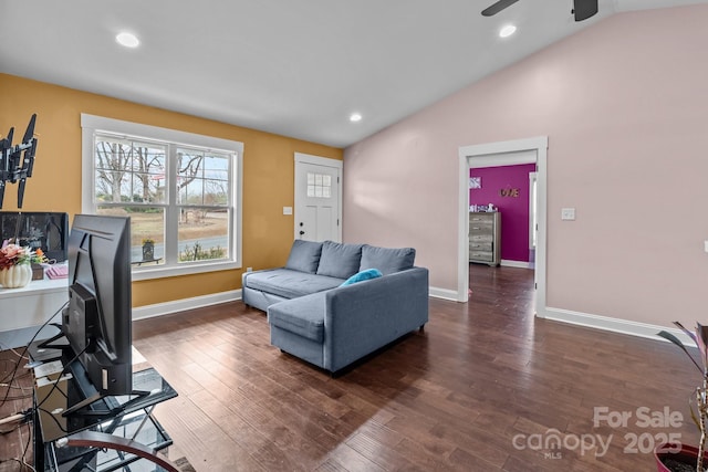 office space featuring lofted ceiling, baseboards, and dark wood finished floors