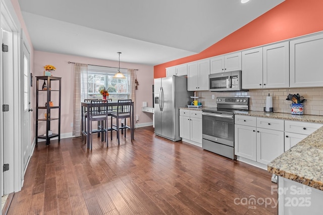 kitchen with pendant lighting, appliances with stainless steel finishes, dark wood-style floors, and white cabinets