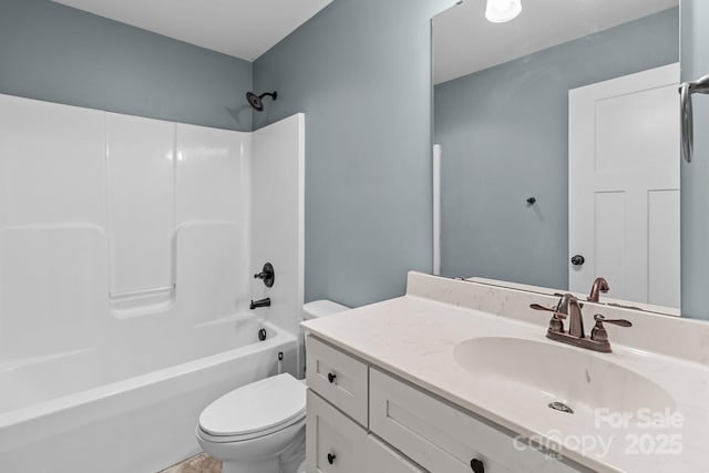 full bathroom featuring  shower combination, vanity, and toilet