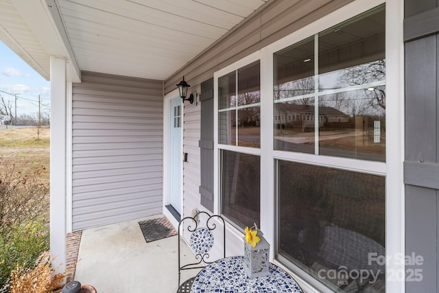 view of exterior entry with covered porch