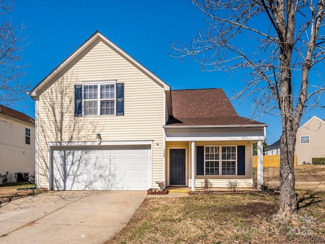 traditional home featuring a garage, central AC, and driveway