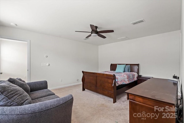 bedroom featuring a ceiling fan, light colored carpet, visible vents, and baseboards
