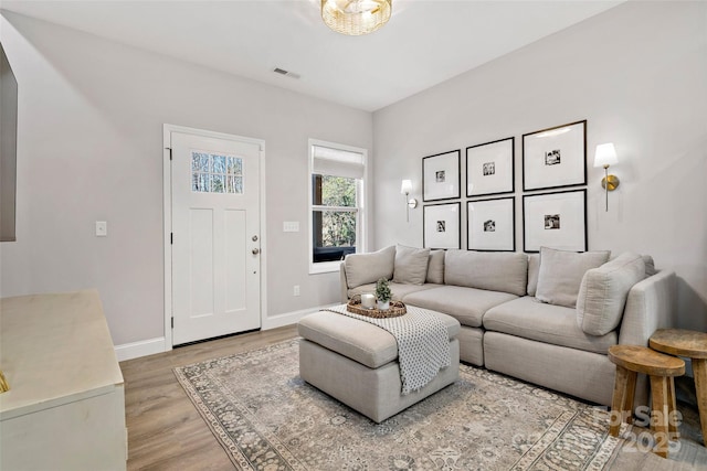 215 David Ridge Rd, Black Mountain, NC 28711 - living area featuring light wood-style floors, visible vents, and baseboards