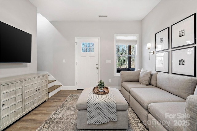 215 David Ridge Rd, Black Mountain, NC 28711 - living room featuring stairway, baseboards, visible vents, and wood finished floors
