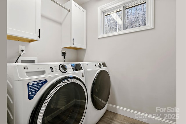 215 David Ridge Rd, Black Mountain, NC 28711 - clothes washing area with independent washer and dryer, wood finished floors, cabinet space, and baseboards