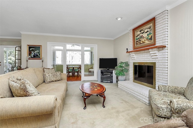 living room featuring ornamental molding, carpet, and a brick fireplace