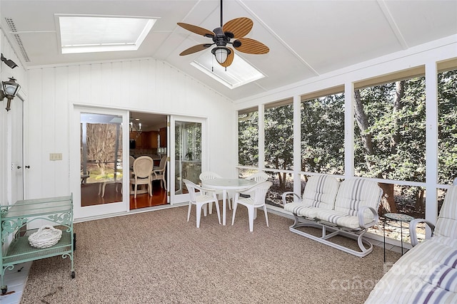 sunroom with lofted ceiling and ceiling fan