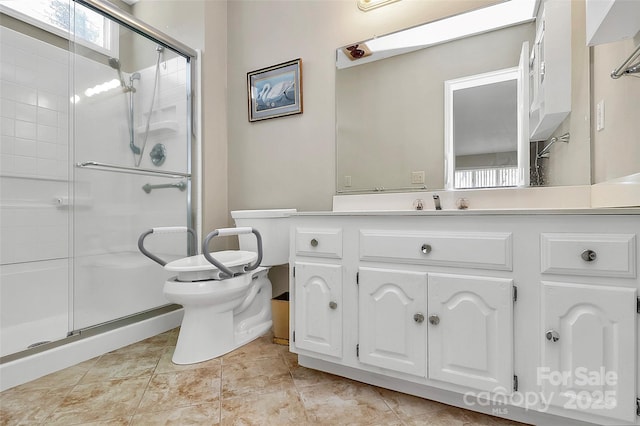 full bath with tile patterned floors, a shower stall, toilet, and vanity