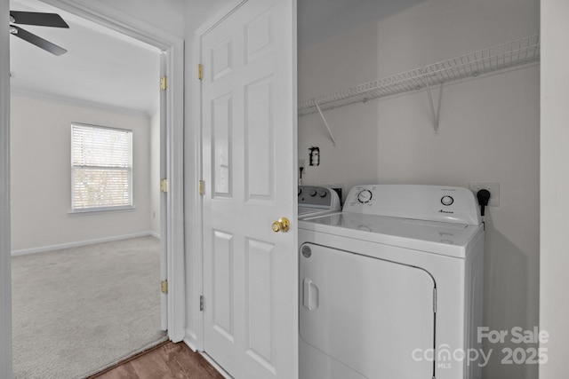 washroom featuring laundry area, baseboards, a ceiling fan, washer and dryer, and carpet floors