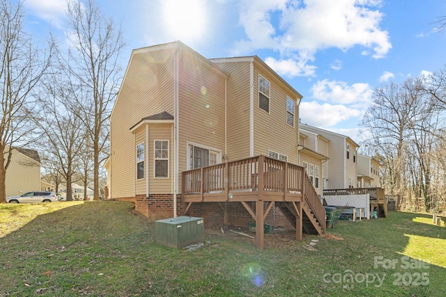 rear view of house with stairs, a yard, a wooden deck, and central air condition unit