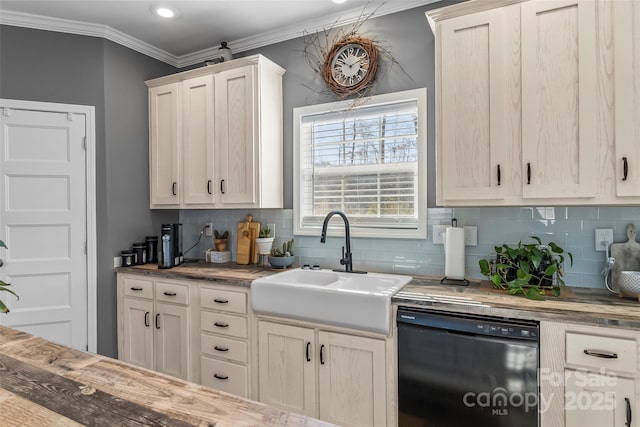 kitchen with black dishwasher, tasteful backsplash, ornamental molding, light countertops, and a sink