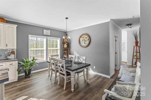 dining room featuring visible vents, an inviting chandelier, dark wood-type flooring, ornamental molding, and baseboards