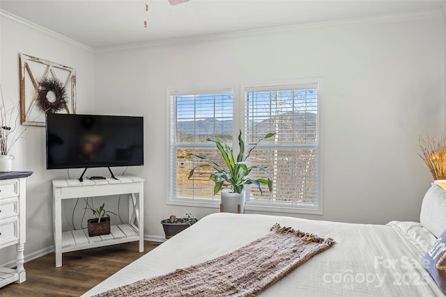 bedroom featuring baseboards, ornamental molding, and dark wood-type flooring