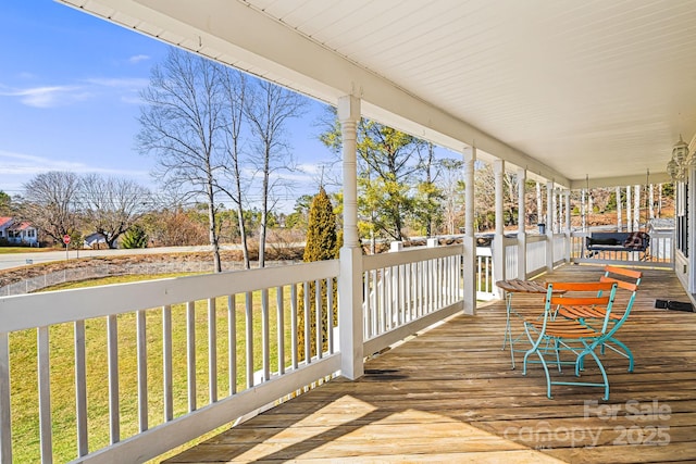 wooden terrace featuring a porch