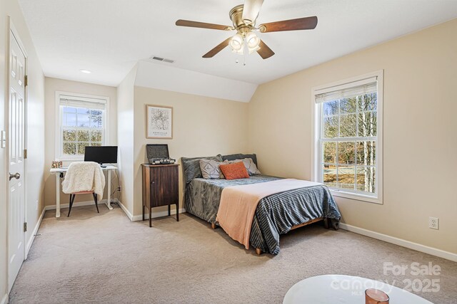 bedroom with visible vents, ceiling fan, light carpet, and baseboards