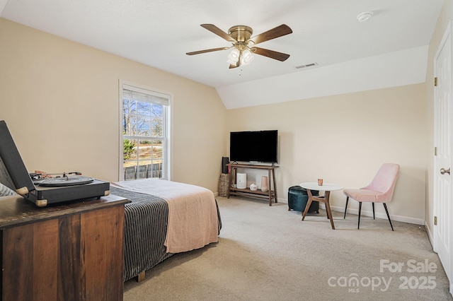 bedroom featuring lofted ceiling, light colored carpet, a ceiling fan, baseboards, and visible vents