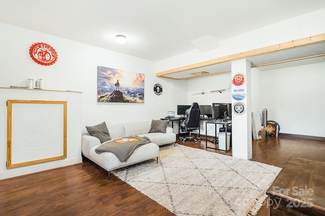 living area featuring dark wood-style floors and baseboards