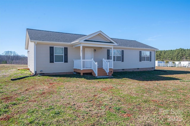 view of front of home featuring a shingled roof, a front yard, and crawl space