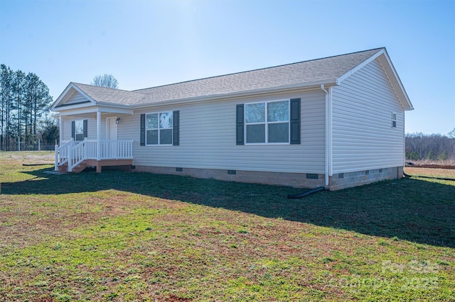 view of front of property with a front yard, crawl space, and roof with shingles