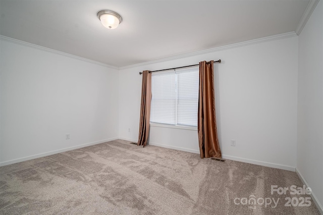 empty room with light carpet, baseboards, visible vents, and crown molding