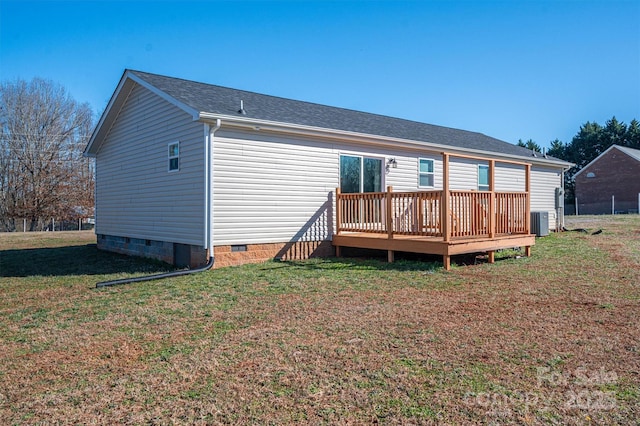 back of property with roof with shingles, a lawn, central AC unit, crawl space, and a deck